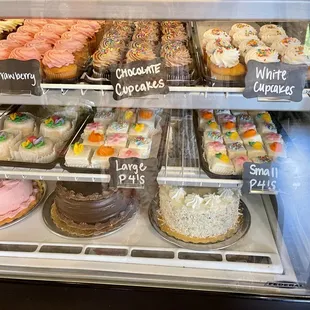 a display case full of cupcakes