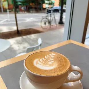 a cup of coffee on a saucer