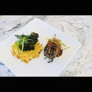 Thyme garlic herbed filet, shallot red wine reduction with potato has Lemongrass broccolini