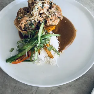 Latin marinated shredded chicken tortilla cups with a black bean, cilantro, and red chile puree.
  Served with sliced asparagus/carrots
