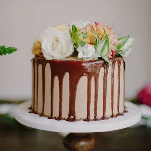 Chocolate Cake with Banana Milk Chocolate Mousse and Peanut Butter Frosting, decorated with fresh florals