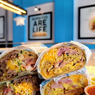 a stack of burritos on a table