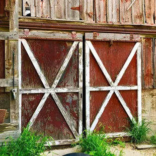 a red barn with two doors