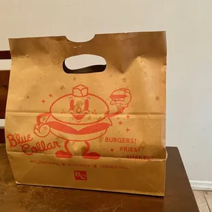 a brown paper bag with a cartoon character on it