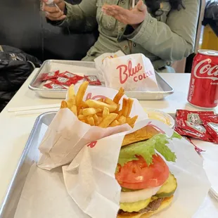 Cheeseburger with everything, Fries with Cheese, Coca-Cola