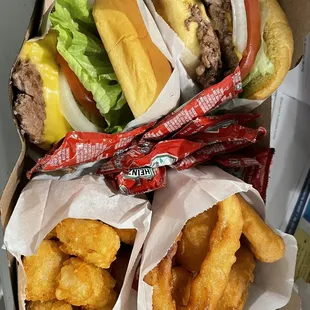 Double cheeseburgers, onion rings and tater tots