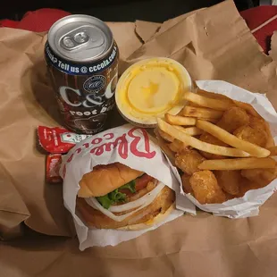Onion cheeseburger, tater tots/French fries, and side of cheese.