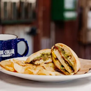 a plate of chips and a sandwich