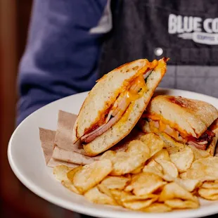 a plate of chips and a sandwich