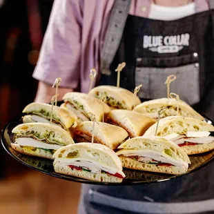 a tray of sandwiches