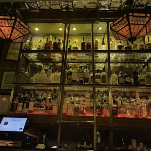 a bar filled with liquor bottles