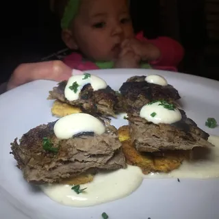 Vaca Frita Topped Tostones