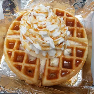 Waffle sundae with caramel syrup, whipped cream and ice cream