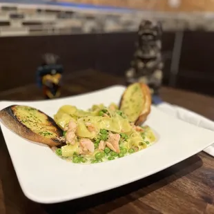 Pappardelle Pasta 
Creamy Garlic sauce with smoked salmon + peas