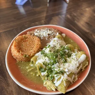 Enchiladas Verdes Served with spanish rice and beans