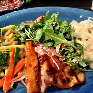 Grilled trout topped with inexplicable yet delicious arugula feta salad.
