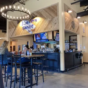 a woman sitting at the bar