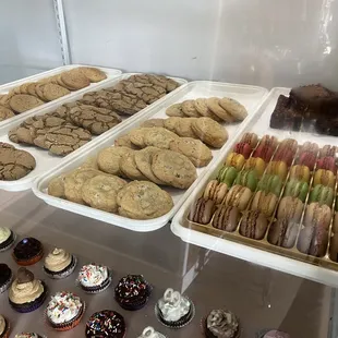 trays of cookies and cupcakes