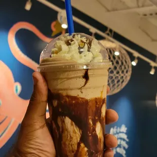 Salted Caramel &amp; Brownie Milkshake with Whipped Cream, Fudge, and Caramel Syrup.