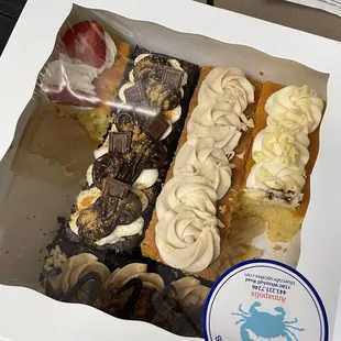 a variety of cupcakes in a box