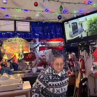 a woman sitting at a bar