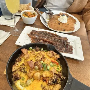 The spread (bottom to top): Breakfast skillet, candied bacon, blueberry &amp; ricotta pancakes. All divine!
