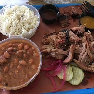 Pulled pork with coleslaw, baked beans and a sample of brisket