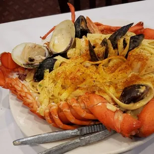 Scampi stuffed lobster with steamed spinach