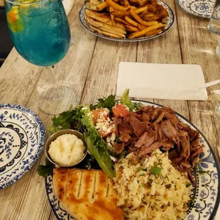 Pork gyro and chicken gyro platter along with the fancy blue drink