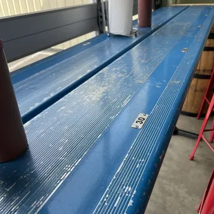High top table made out of an old bleacher seat.