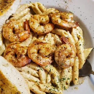 a plate of pasta with shrimp