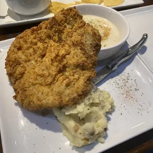 Chicken fried steak and remnants of the spinach artichoke dip