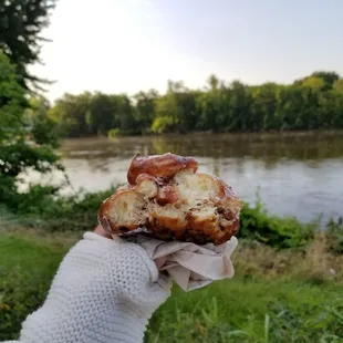 Enjoying my Apple fritter at River's Edge Commons.. beautiful day!