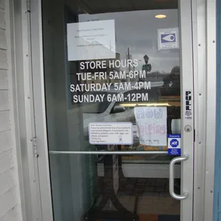 Hours of operation, front entry door.
