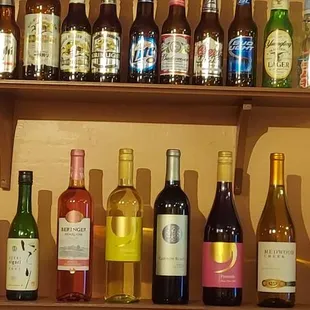 a shelf of wine bottles