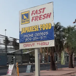 a sign advertising fast fresh japanese food