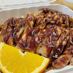 Chicken teriyaki over rice.