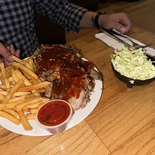 my hubbys plate - brisket and pork and fries and cole slaw