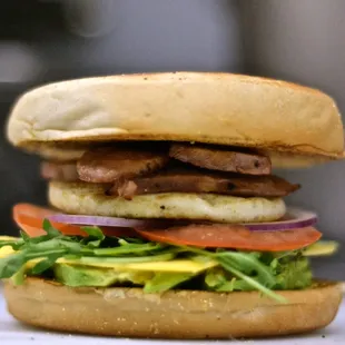 The Big Blue! - Breakfast sausage, fried egg, aged cheddar, avocado, tomato, arugula and red onion on a toasted english muffin