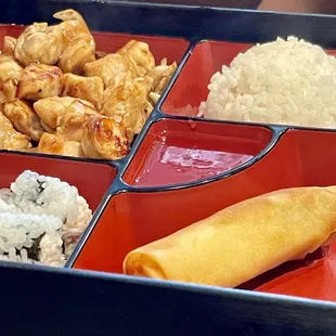 Teriyaki Chicken Bento Box with 6 pieces of California Roll, White Rice, Egg Roll, and Choice of Soup or Salad.