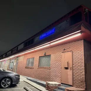 Outside, look for the sign, side entrance