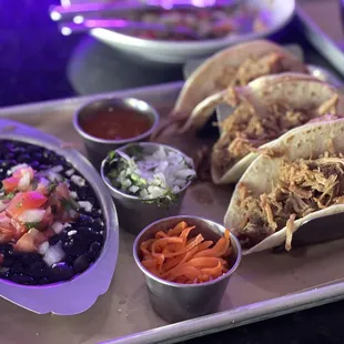 Carnitas tacos with black beans -