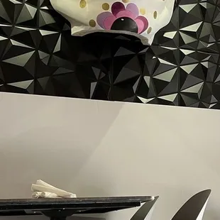 a skull hanging above a table
