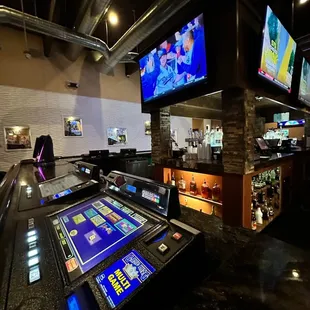 a bar with a large screen tv