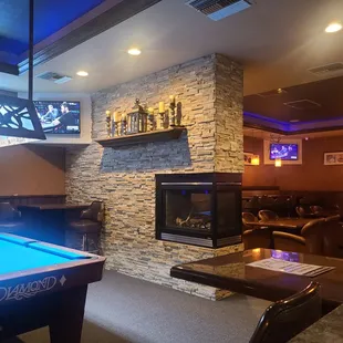 pool table and fireplace