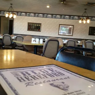 a restaurant with tables and chairs