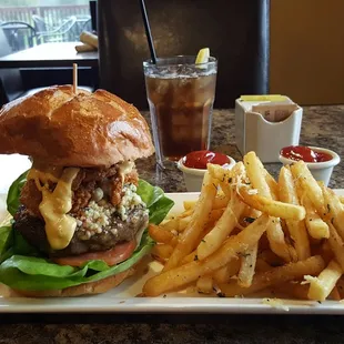 Signature Blue Heron burger w bacon and garlic fries. Delicious!