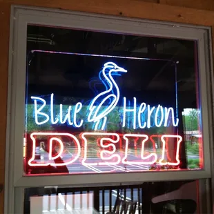a neon sign in a window