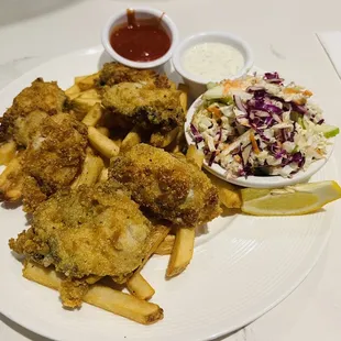 Their Pan Seared Oyster main dish on a bed of crispy fries with side of coleslaw (it was delicious)