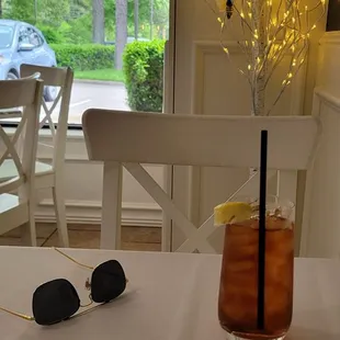 Unsweetened iced tea with a lemon wedge.